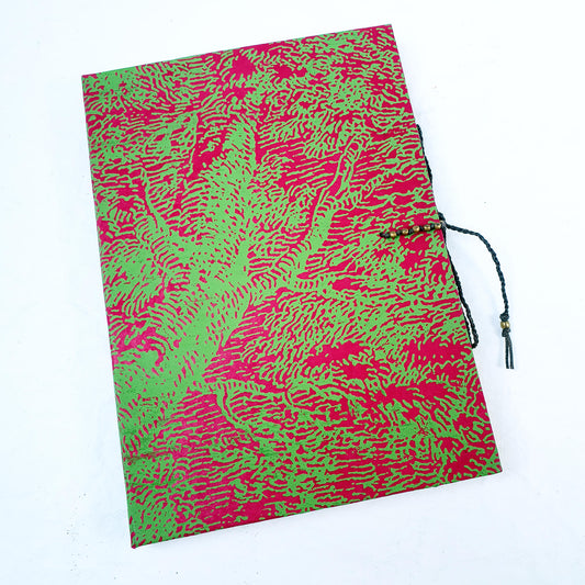 A bright wood patterned cover journal with a decorative fastener, this version is green and fushia pink
