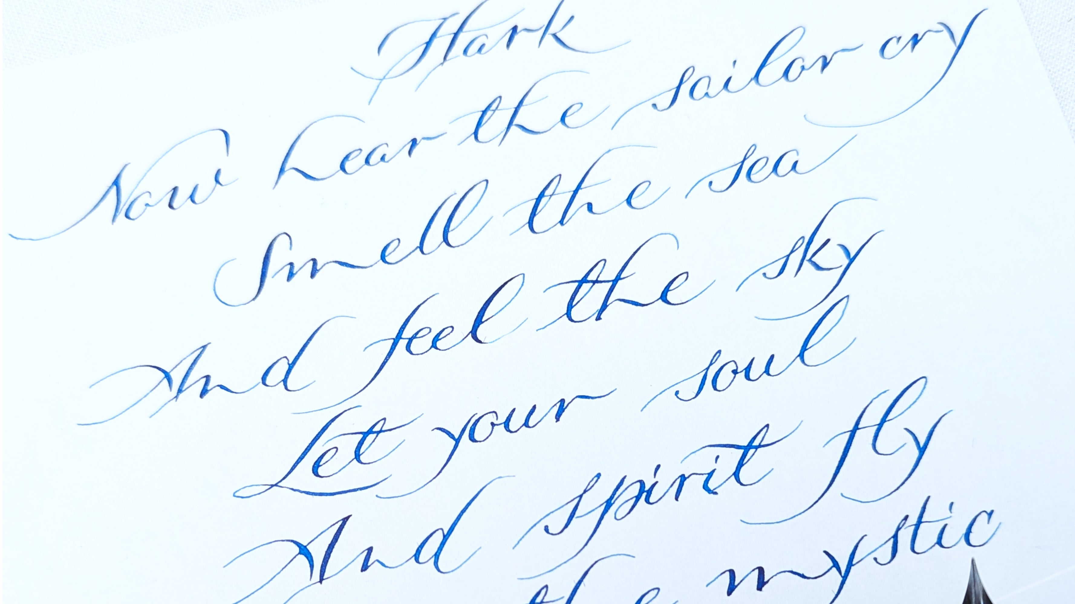 Hand written calligraphy hand: Modern copperplate - Handwritten诗句 on a white background