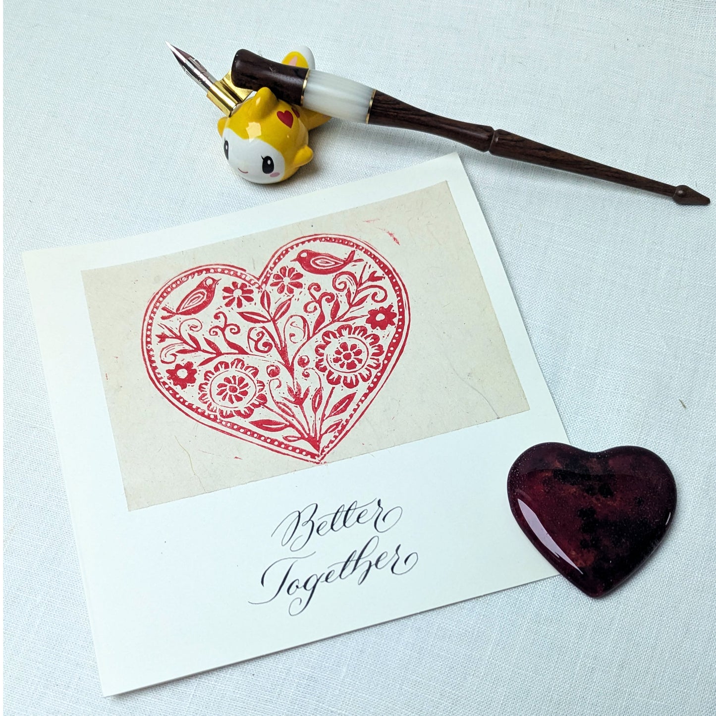 This handmade card features an original heart-shaped lino print filled with floral and bird motifs — a design that speaks of growth, harmony, and the small, living details that make a partnership flourish. It’s a calm, thoughtful expression of togetherness, without grand promises or excess sentiment.