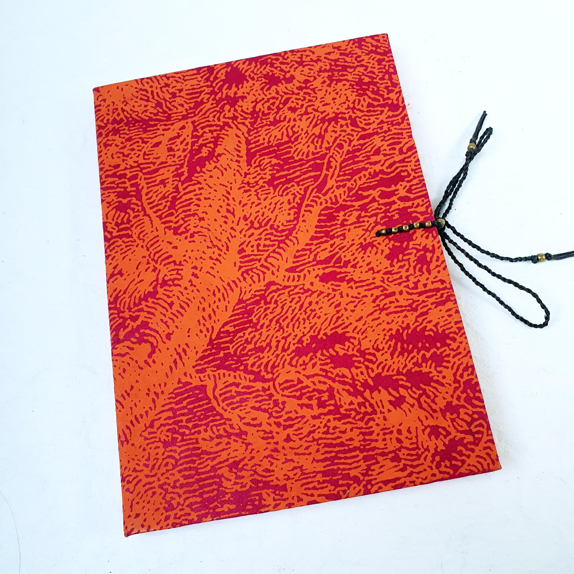 an elegant journal with a bright orange cover perfect for gifting