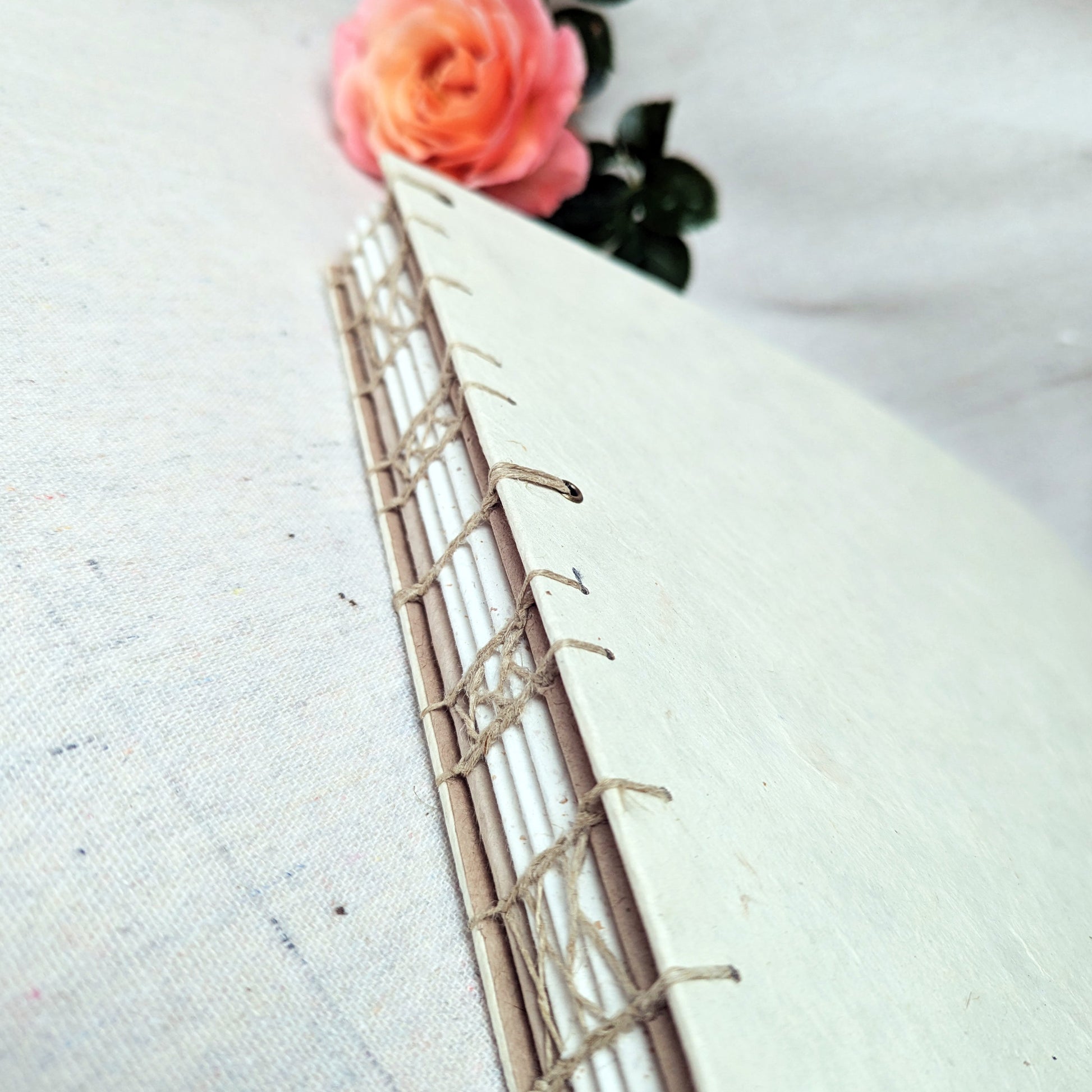 Decorative French stitch binding using linen thread on artisanal photo album